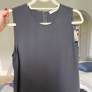 Brand new black silk type top.
